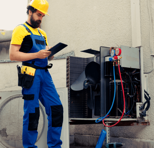 Technician looking for freon leaks